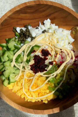 chili crisp egg salad with cucumber and radishes